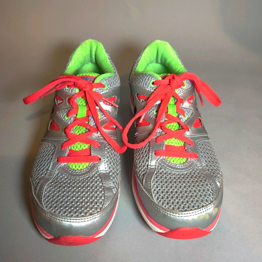 Women's neon colored Nike running/athletic shoes